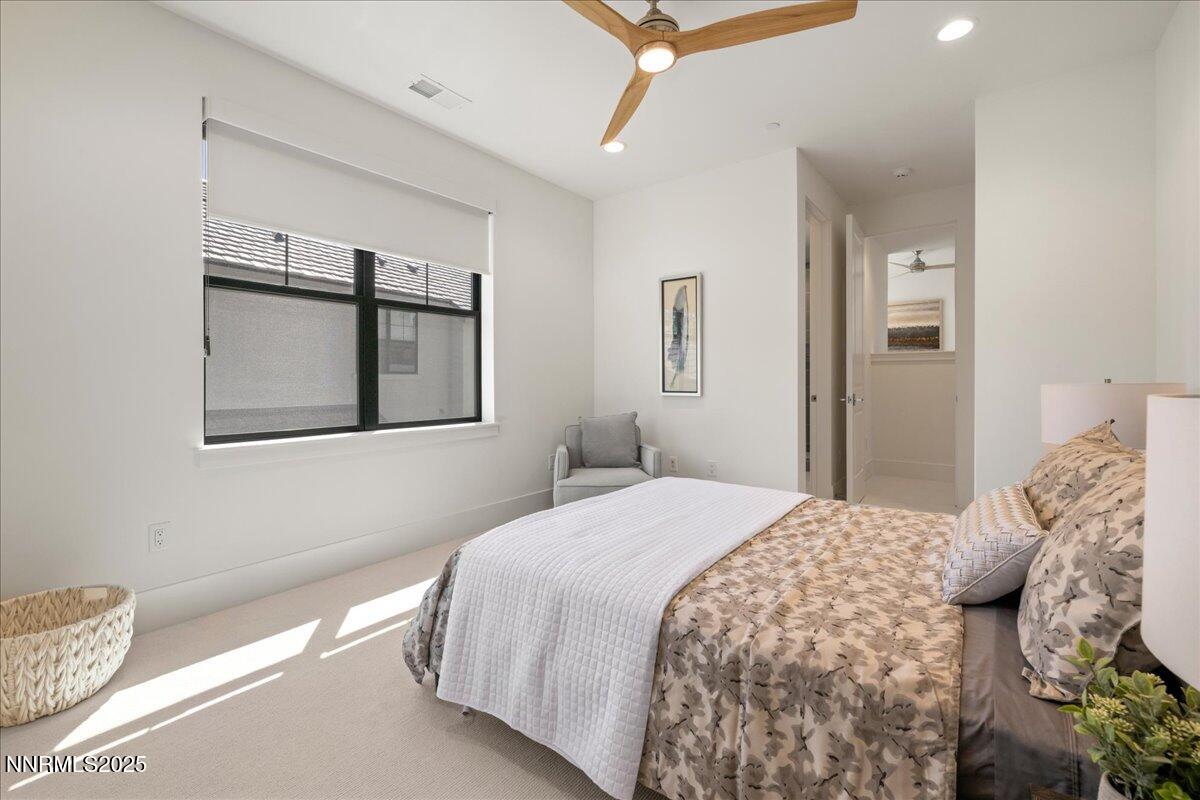 20555 Latour Way Reno, NV 89511 - Photo 45 of 59 a bedroom with a bed and a painting on the wall