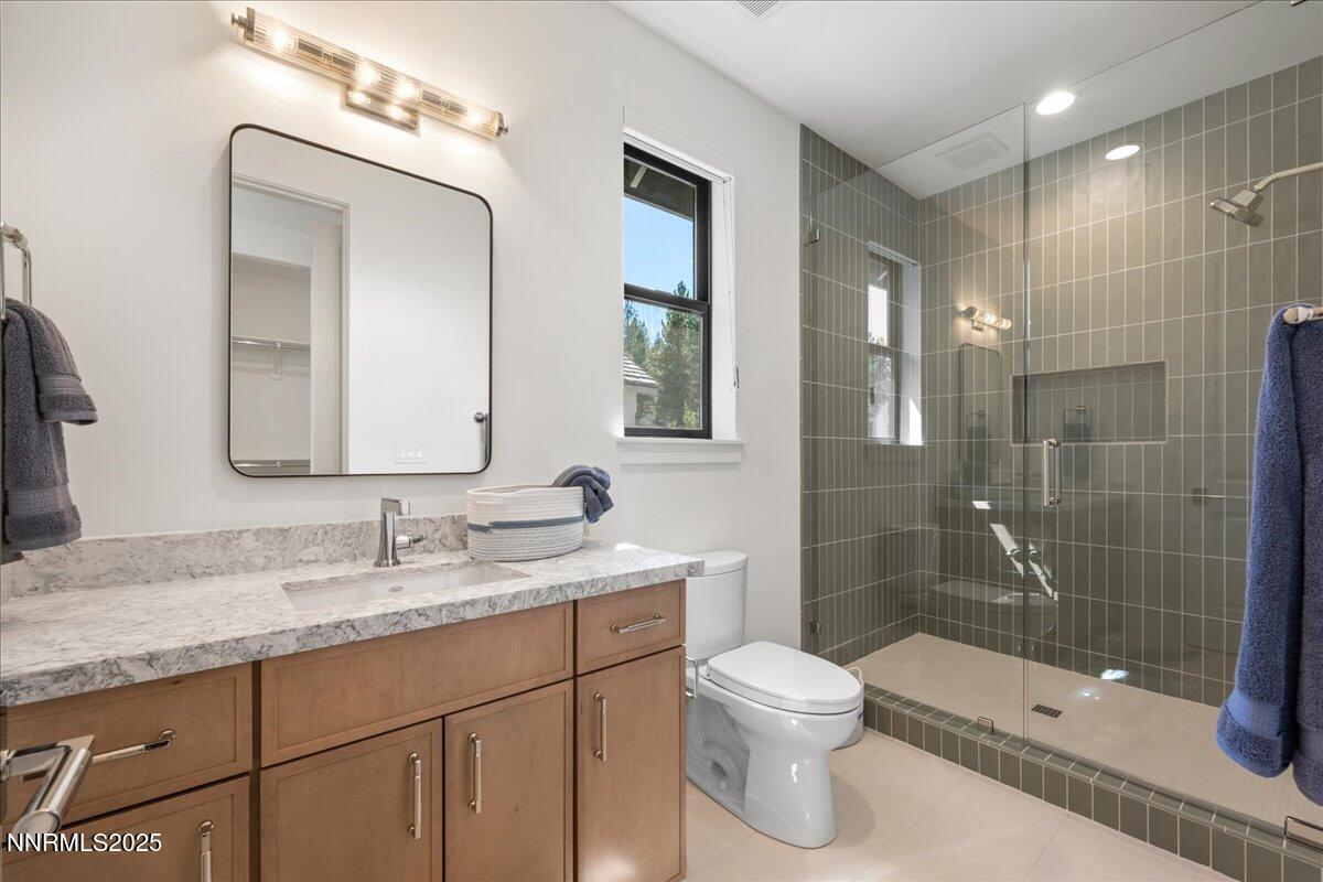 20555 Latour Way Reno, NV 89511 - Photo 46 of 59 a bathroom with a toilet a sink and shower