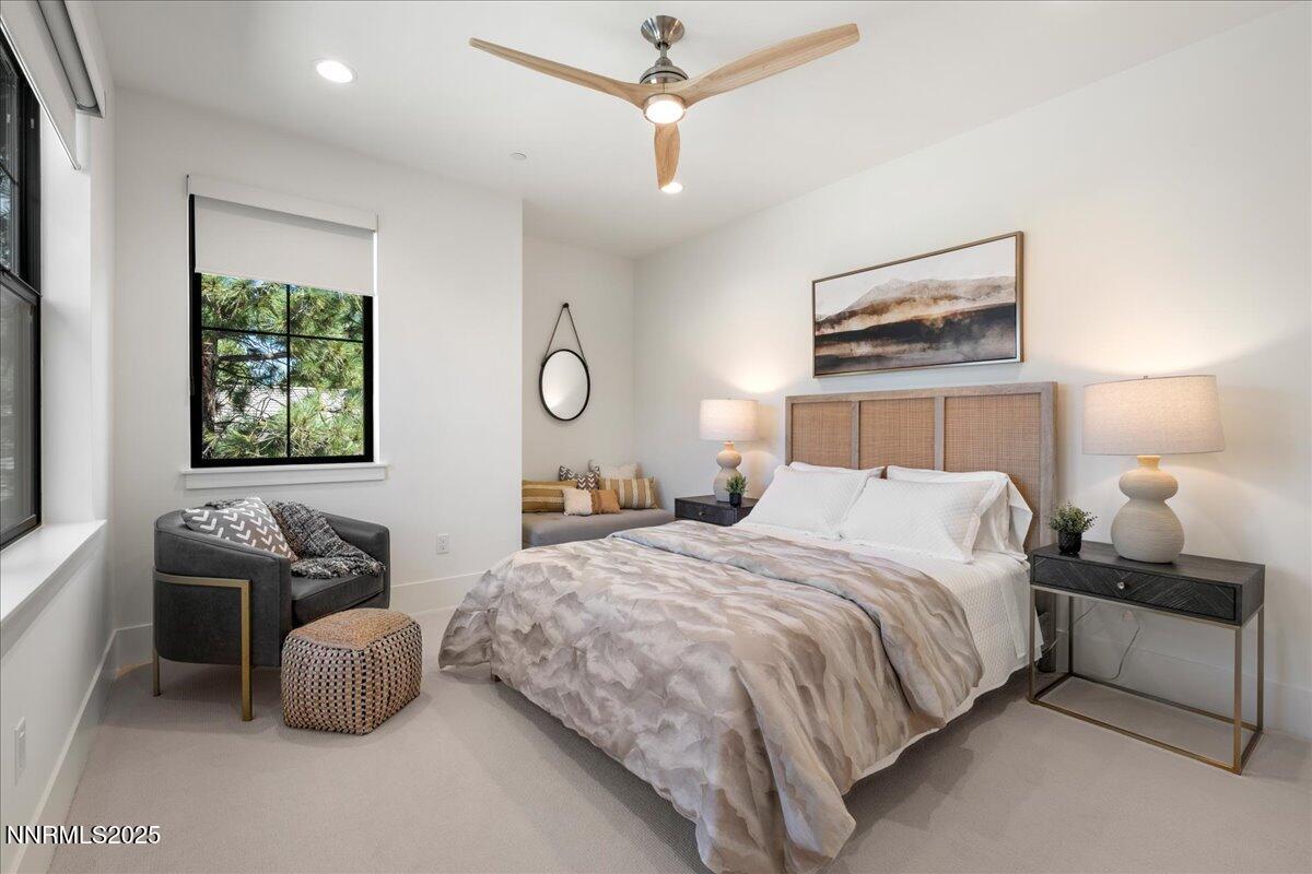 20555 Latour Way Reno, NV 89511 - Photo 47 of 59 a bedroom with a bed and a chandelier