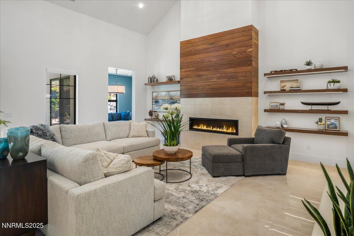 20555 Latour Way Reno, NV 89511 - Photo 8 of 59 a living room with furniture and a fireplace