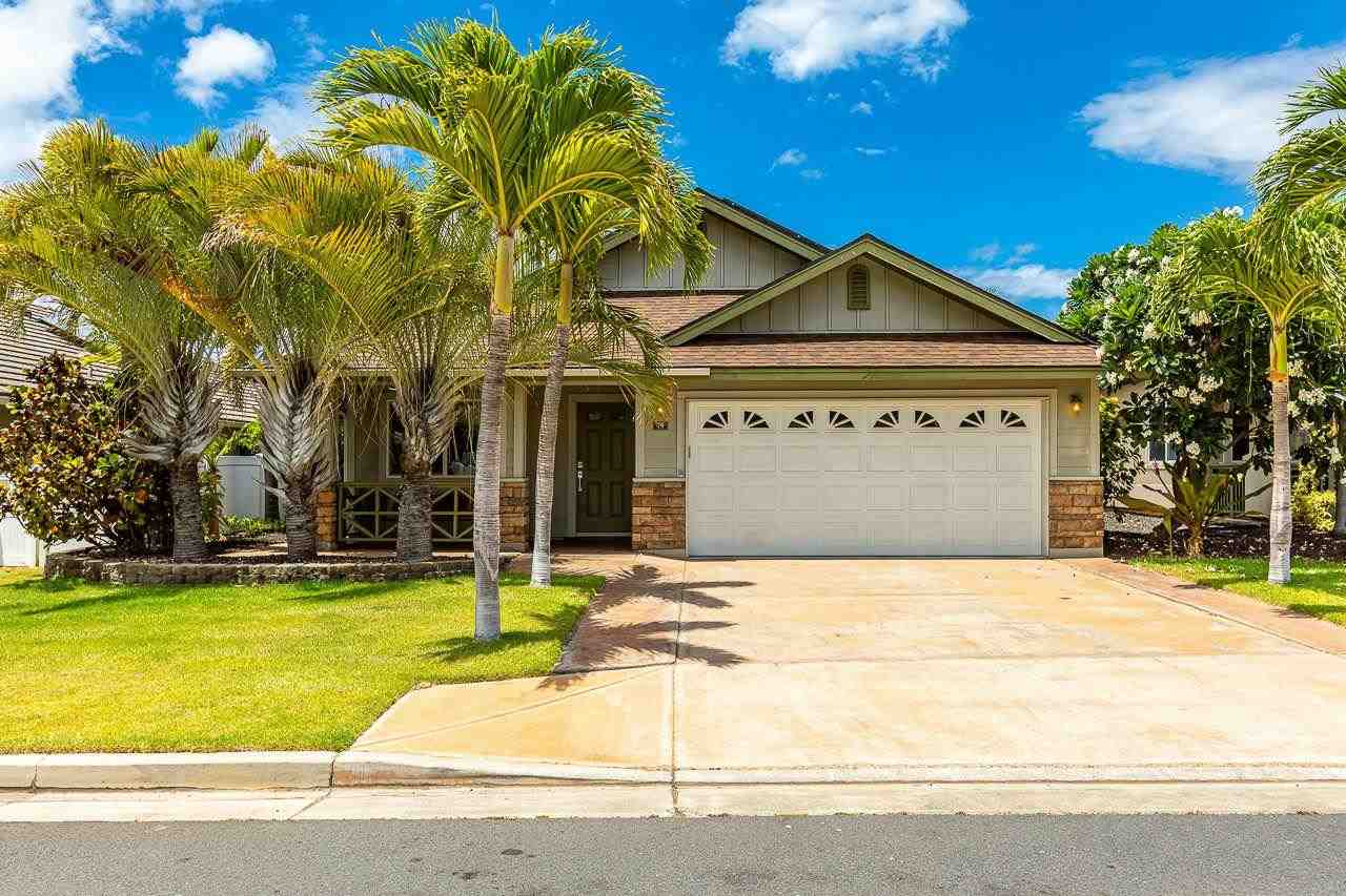 a house with palm tree in front of it