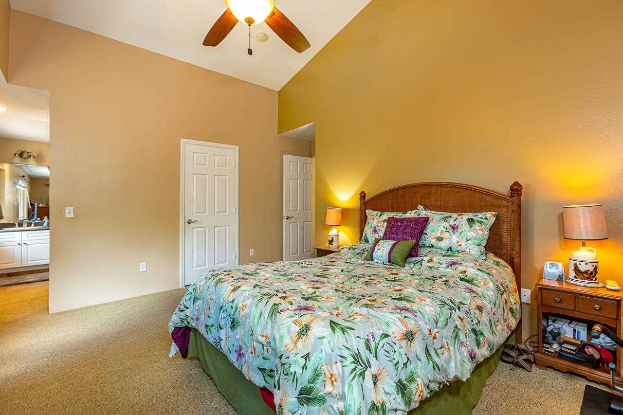 79 Molehulehu Loop Kahului, HI 96732 - Photo 16 of 29 a bedroom with a bed and a lamp
