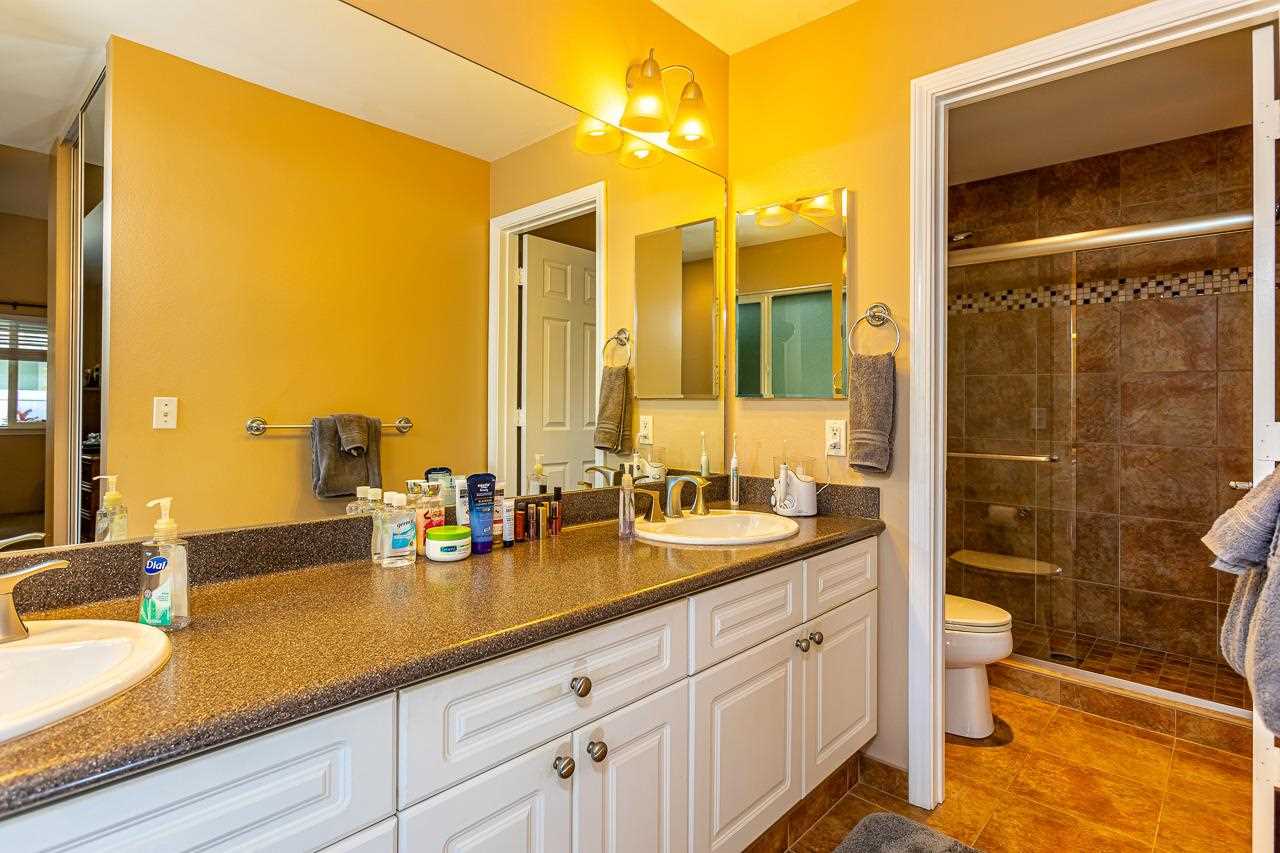 79 Molehulehu Loop Kahului, HI 96732 - Photo 17 of 29 a bathroom with a double vanity sink toilet and shower