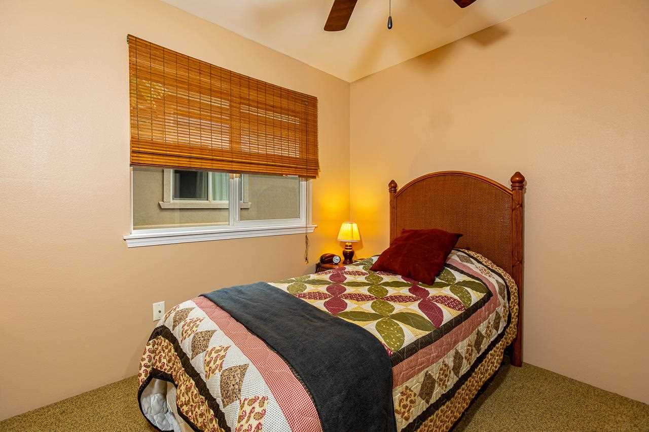 79 Molehulehu Loop Kahului, HI 96732 - Photo 21 of 29 a bedroom with a bed and wooden floor