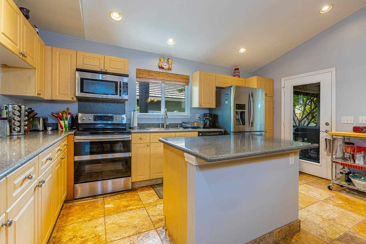 79 Molehulehu Loop Kahului, HI 96732 - Photo 8 of 29 a kitchen with stainless steel appliances granite countertop a stove and a sink