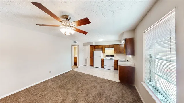 a view of a livingroom with a kitchen