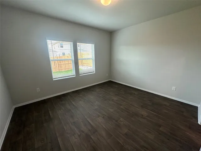 a bathroom with a double vanity sink and mirror