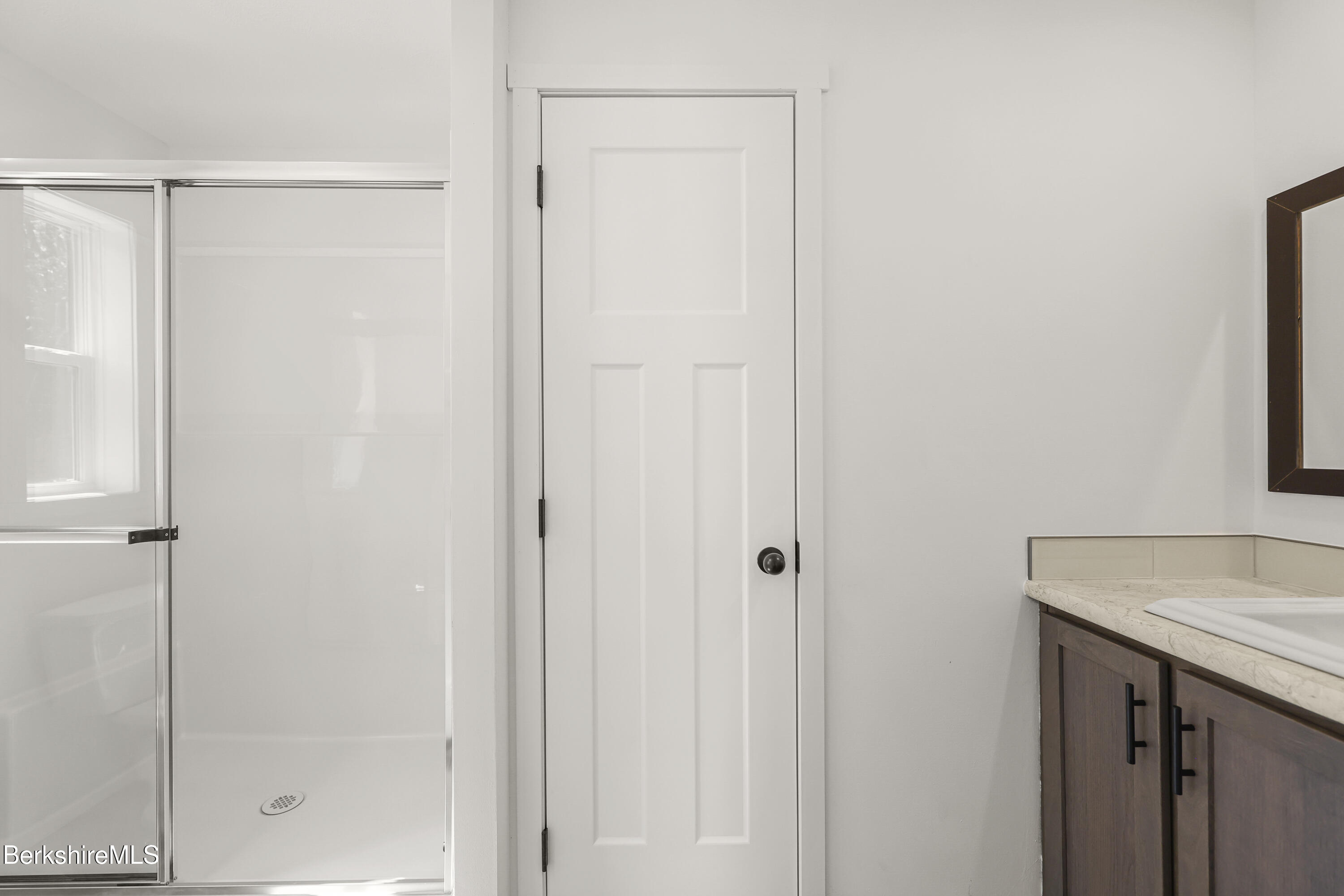 395 Cheshire Road, Unit 112 Pittsfield, MA 01201 - Photo 22 of 32 a bathroom with a shower and a sink