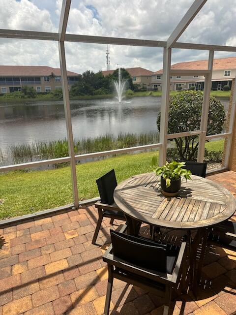 524 Southwest Glen Crest Way Stuart, FL 34997 - Photo 13 of 43 a view of a lake from a balcony with a patio