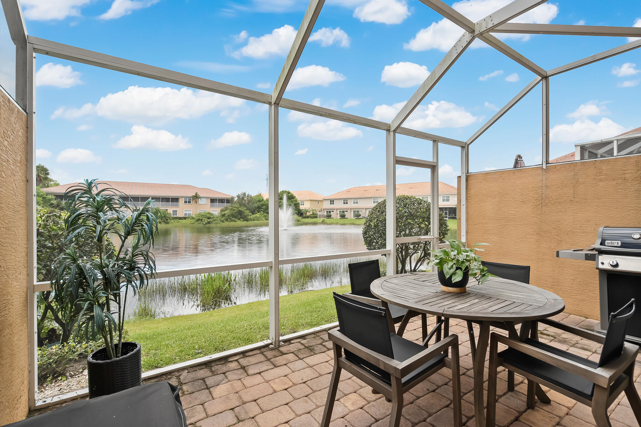 524 Southwest Glen Crest Way Stuart, FL 34997 - Photo 14 of 43 a view of a porch with furniture and a yard