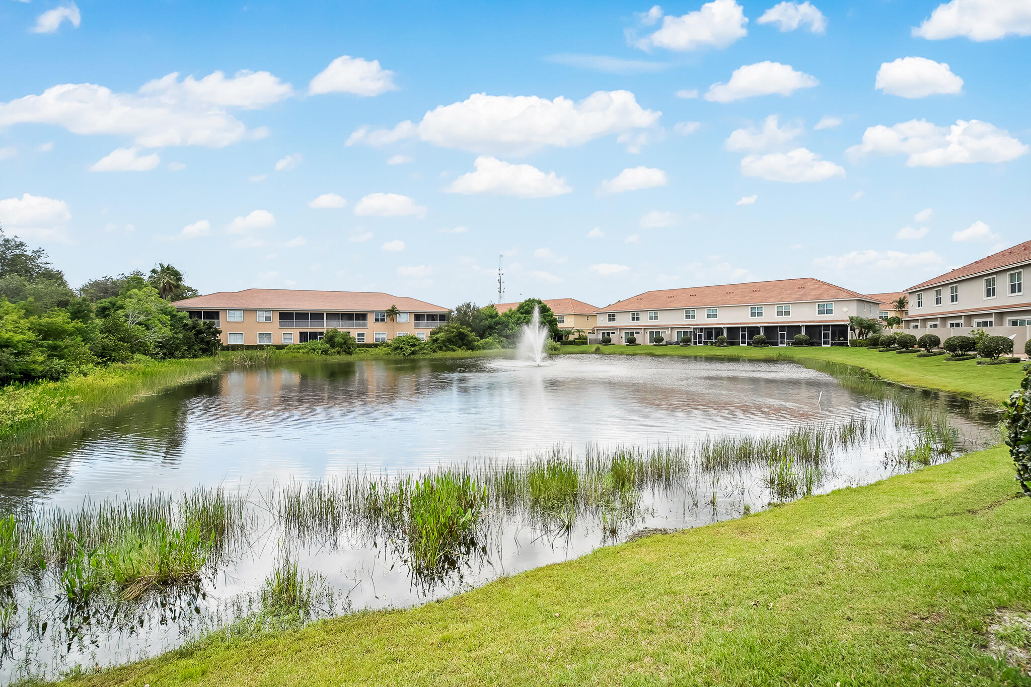 524 Southwest Glen Crest Way Stuart, FL 34997 - Photo 17 of 43 a view of a lake with houses in the back