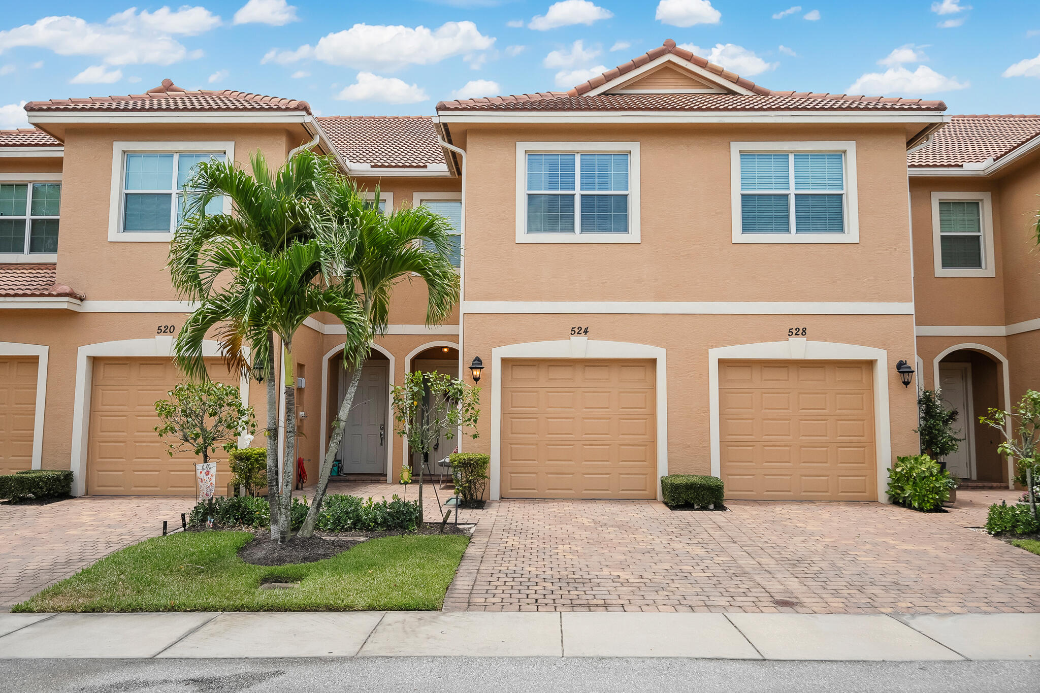 524 Southwest Glen Crest Way Stuart, FL 34997 - Photo 23 of 43 a front view of a house with garden