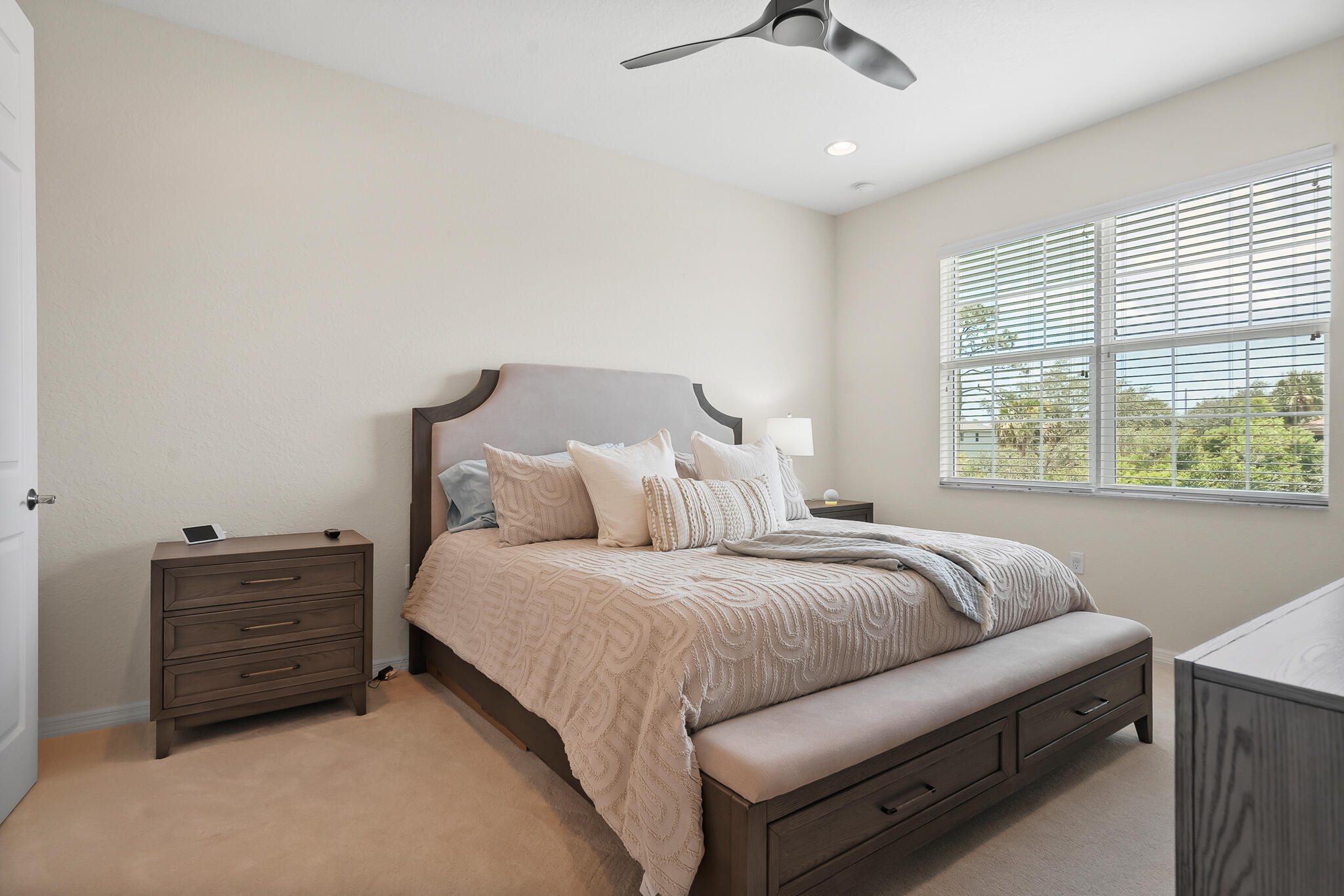 524 Southwest Glen Crest Way Stuart, FL 34997 - Photo 24 of 43 a living room with a bed furniture and a window