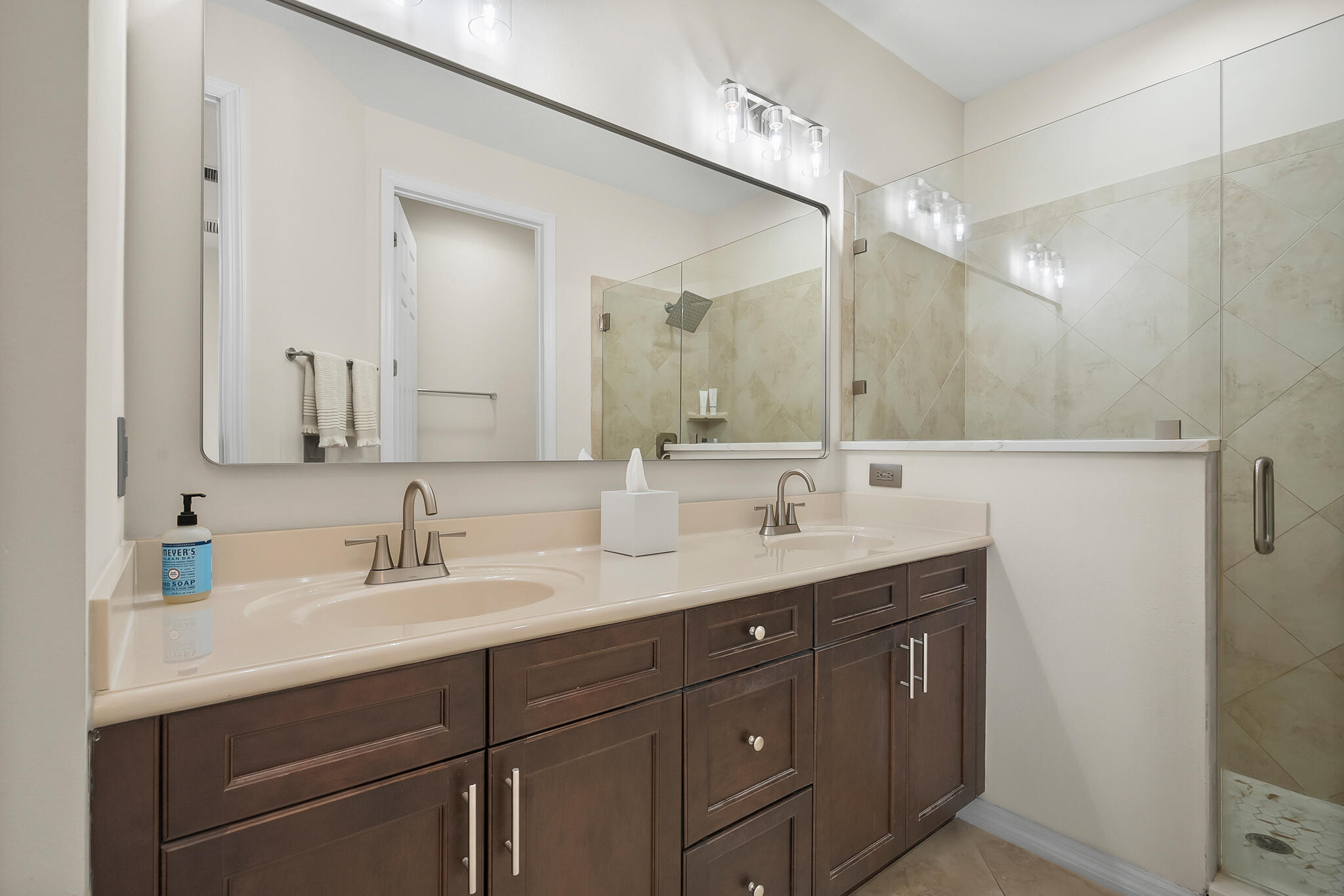 524 Southwest Glen Crest Way Stuart, FL 34997 - Photo 27 of 43 a bathroom with a sink and a mirror