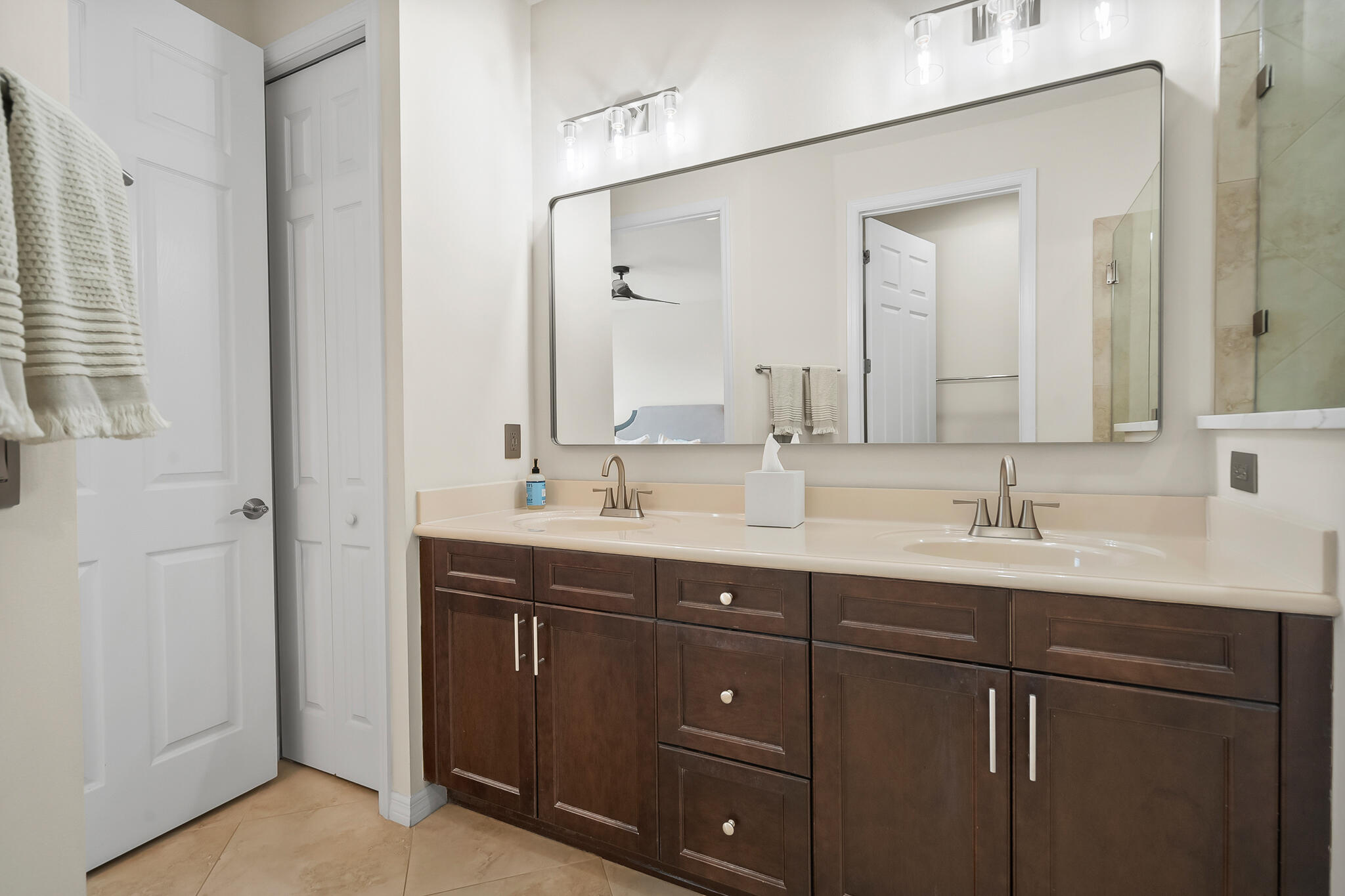 524 Southwest Glen Crest Way Stuart, FL 34997 - Photo 29 of 43 a bathroom with a sink and a mirror