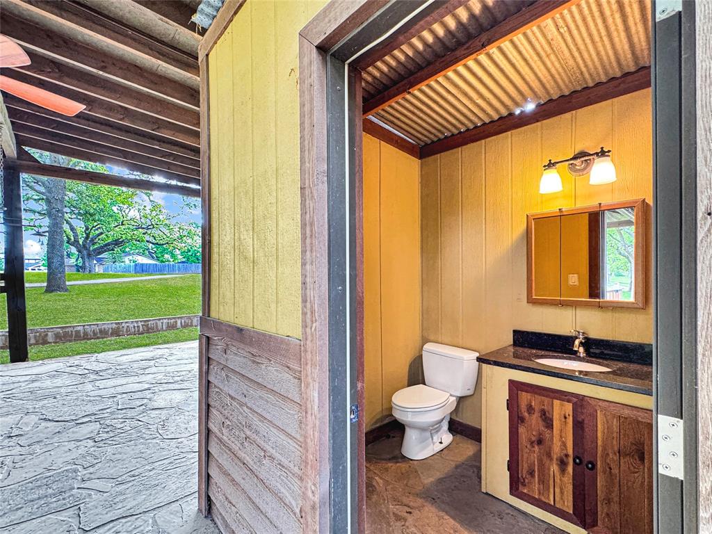 1205 Forest Ridge Drive Bedford, TX 76022 - Photo 9 of 40 Half bath in the outdoor patio.