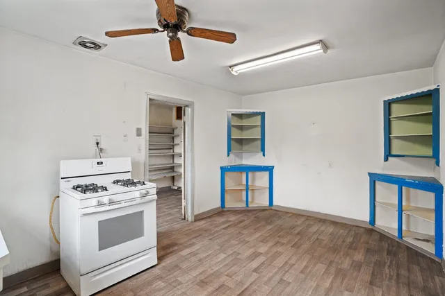 a kitchen with stainless steel appliances a stove and a refrigerator