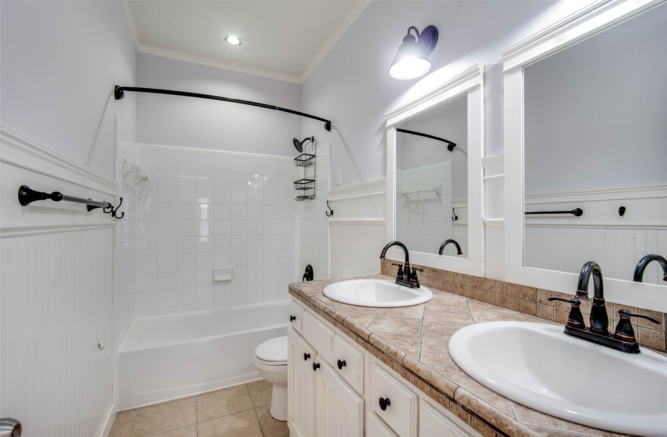 9323 Hillhaven Court Rosenberg, TX 77469 - Photo 31 of 37 a bathroom with a sink double vanity granite tub shower and a mirror