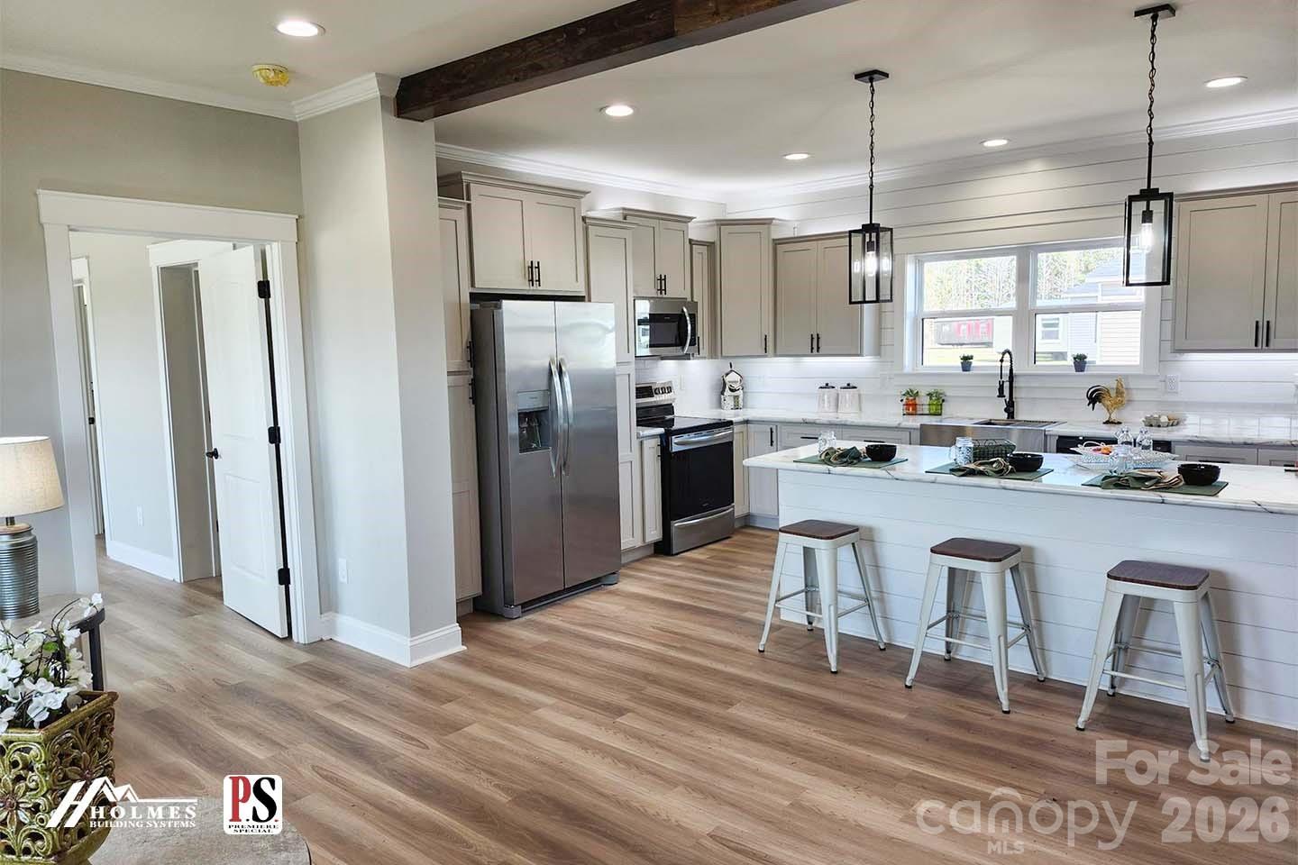 4366 Boulder Drive Morganton, NC 28655 - Photo 2 of 4 a kitchen with kitchen island granite countertop a refrigerator and a stove top oven