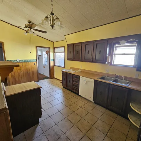 a large kitchen with a cabinets and outdoor space