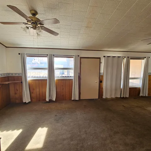 a view of an empty room with a window