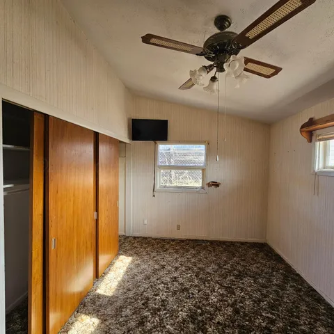 a view of a hallway with a chandelier