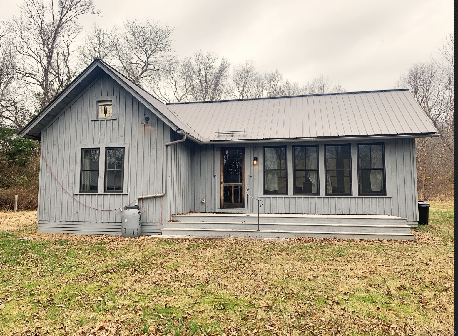 a house with trees in the background