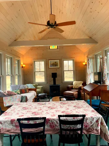 a bedroom with furniture and a window