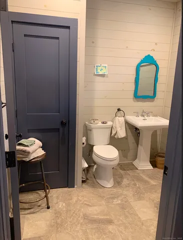 a bathroom with a glass shower door