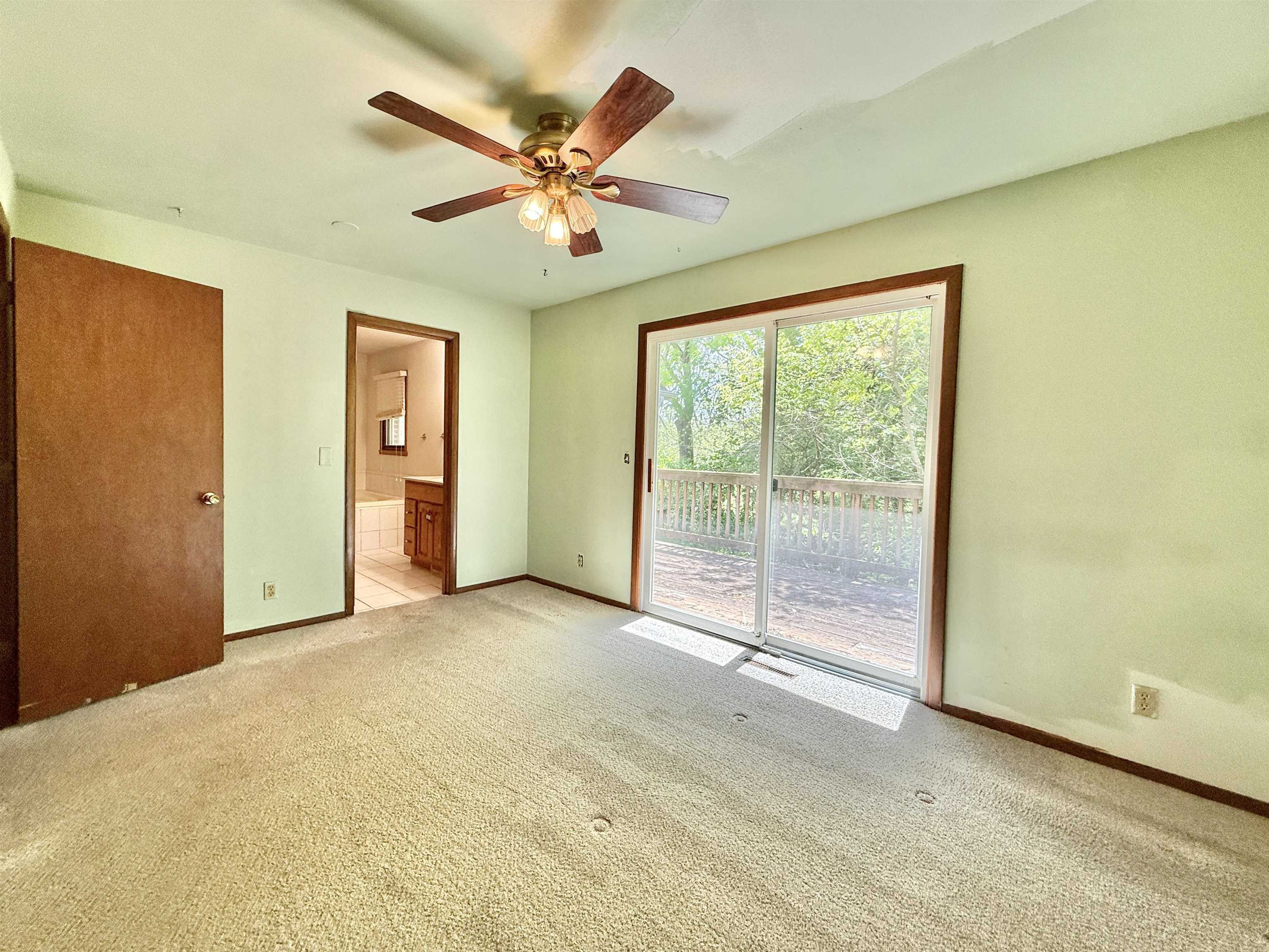 3620 Valerie Road Roscoe, IL 61073 - Photo 14 of 26 a view of a livingroom with a ceiling fan and window