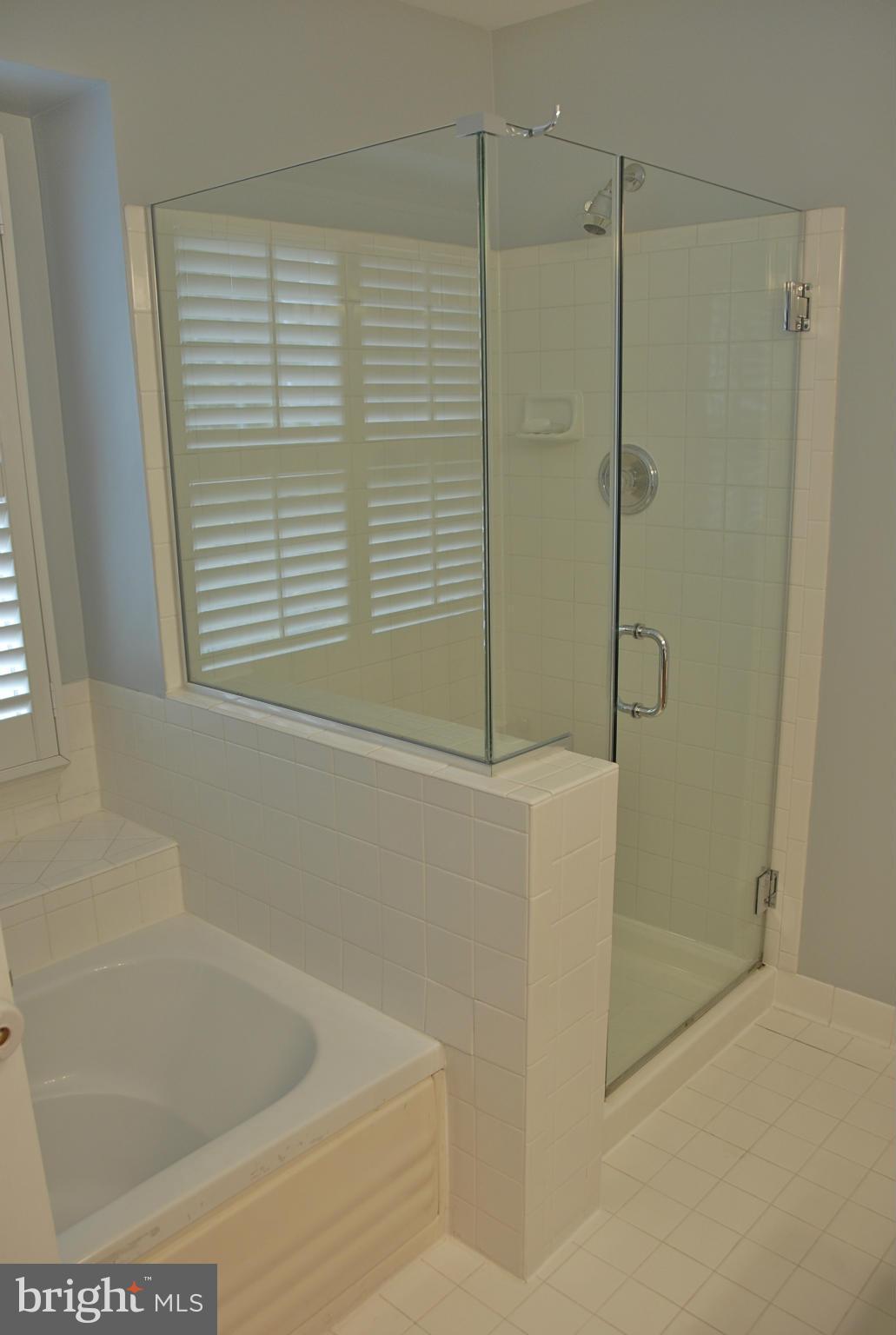 1273 Weatherstone Court Reston, VA 20194 - Photo 17 of 24 a bathroom with a shower and a bathtub