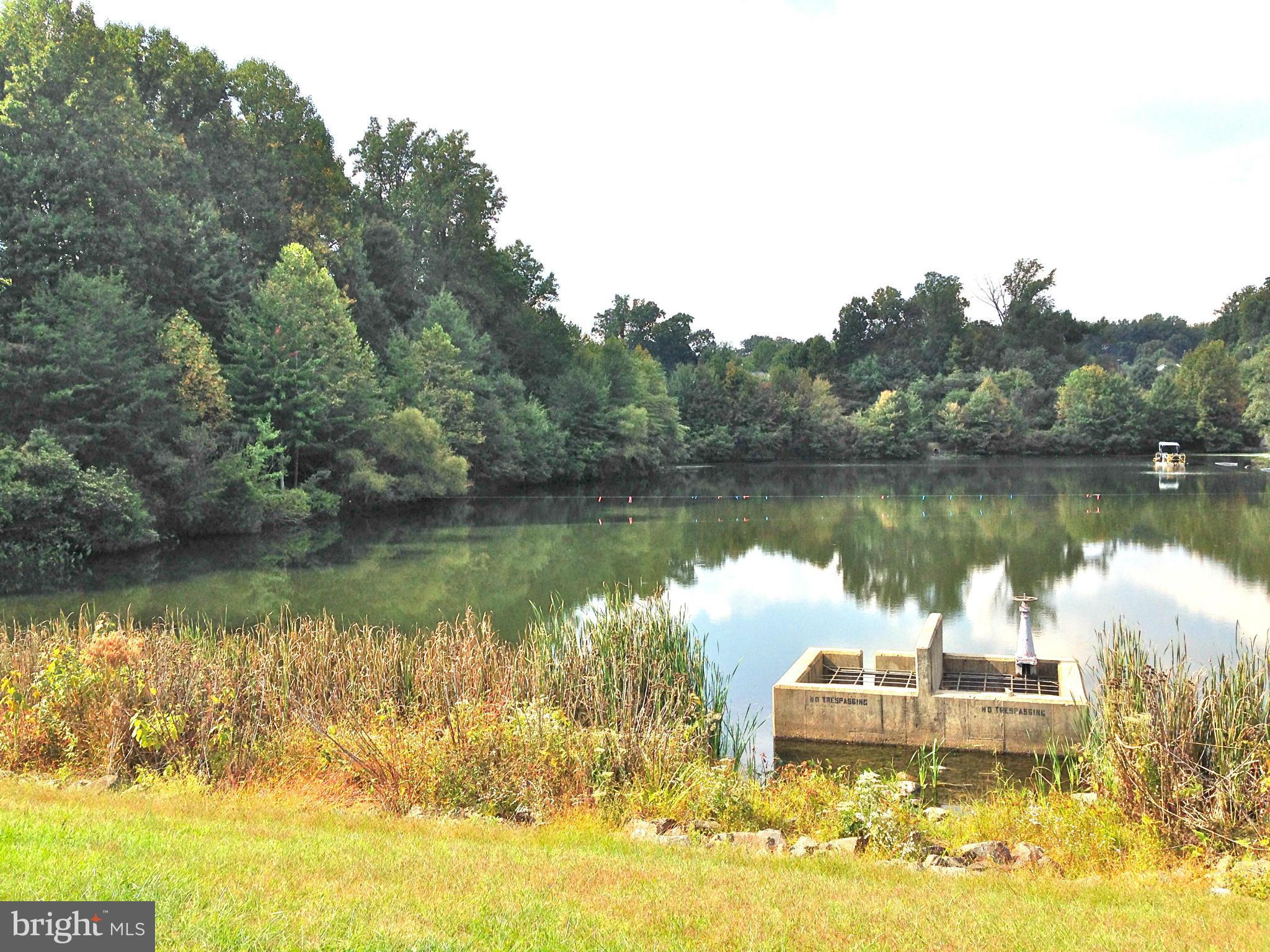 1273 Weatherstone Court Reston, VA 20194 - Photo 24 of 24 a view of a lake with houses