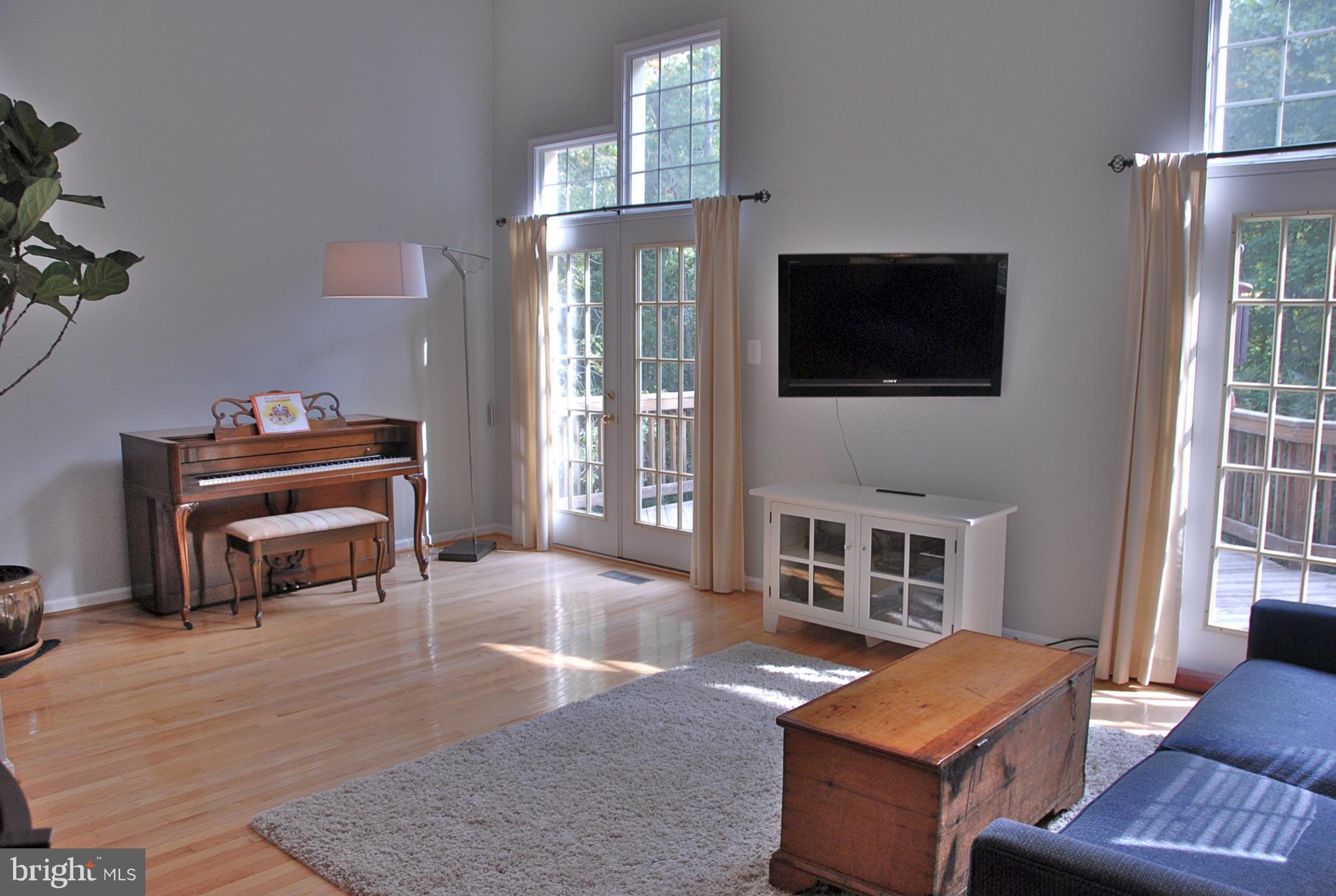 1273 Weatherstone Court Reston, VA 20194 - Photo 6 of 24 a living room with furniture and a fireplace