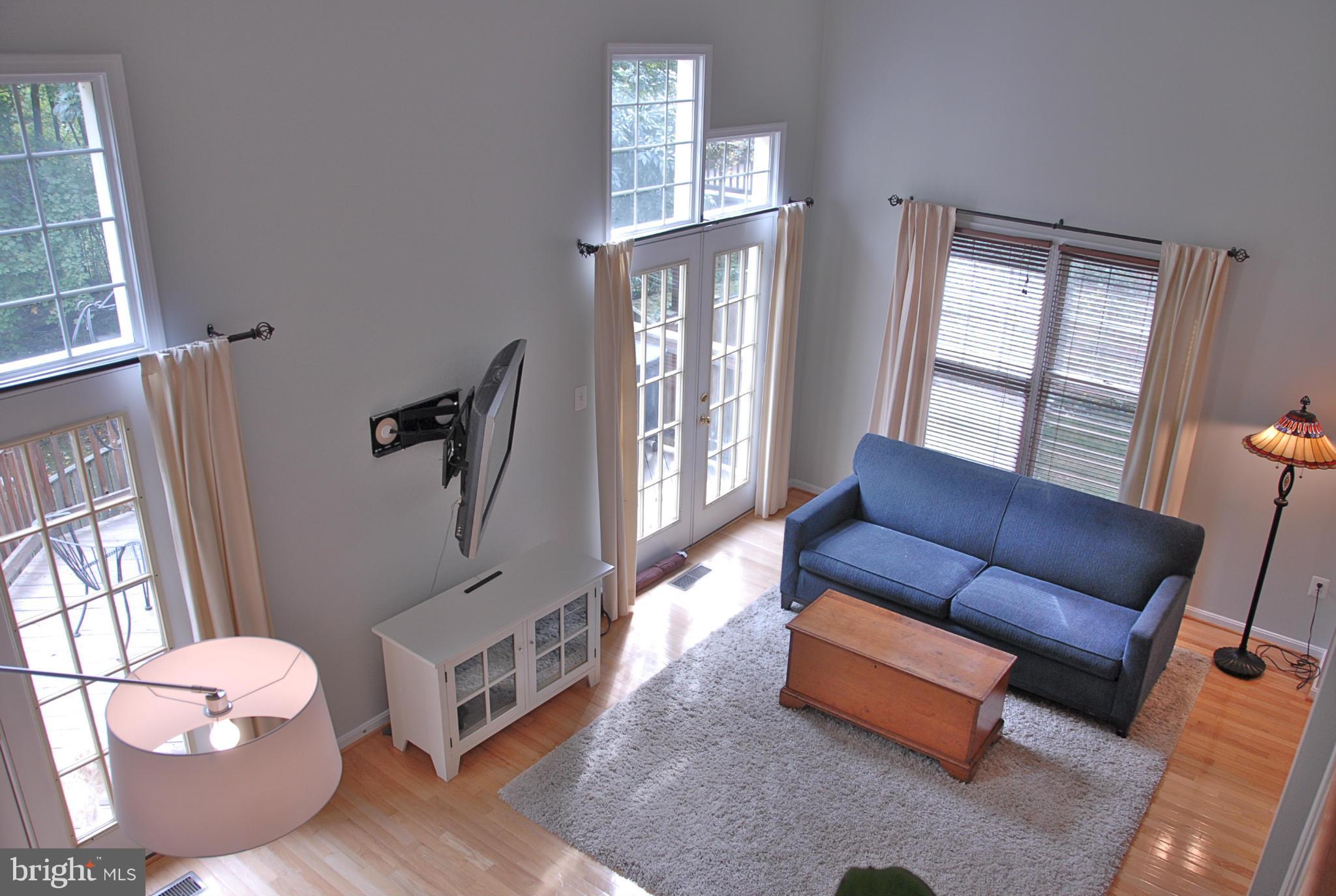 1273 Weatherstone Court Reston, VA 20194 - Photo 7 of 24 a living room with furniture and a window