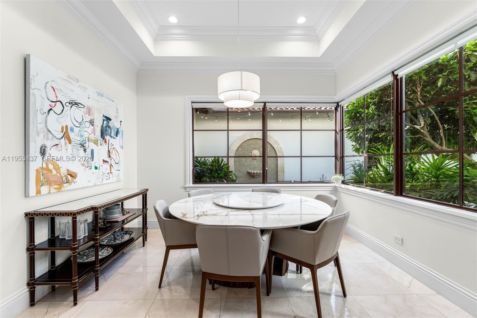 5865 Southwest 96th Street Pinecrest, FL 33156 - Photo 21 of 32 a dining room with furniture and window