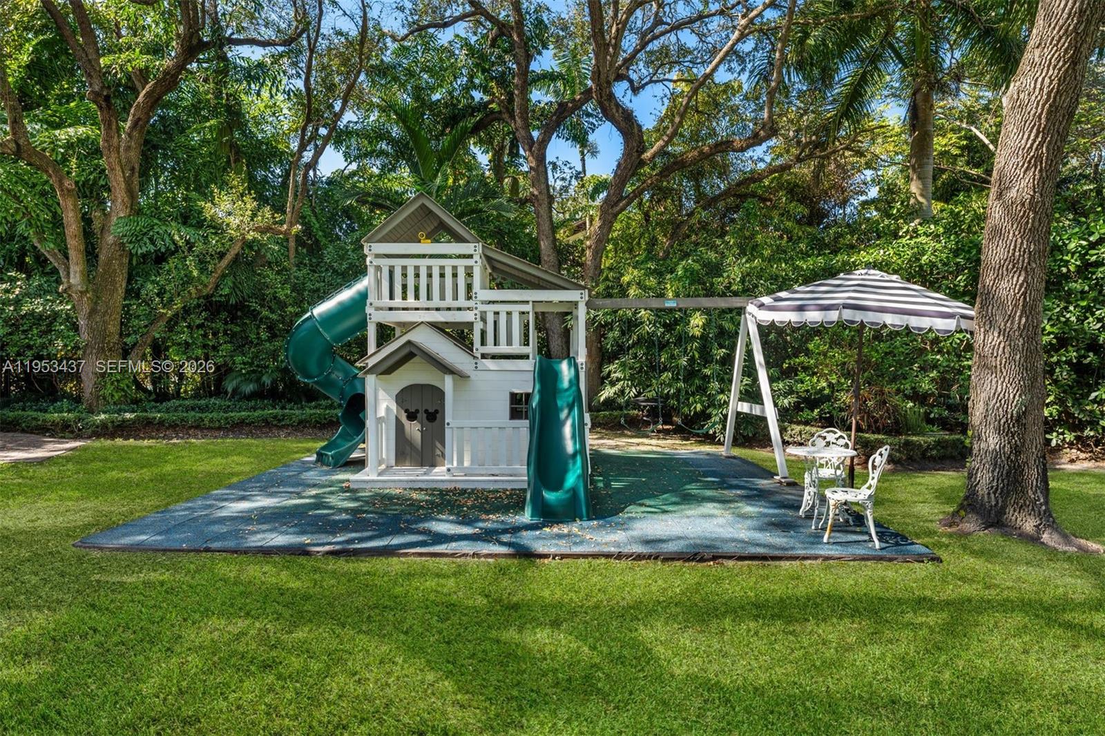 5865 Southwest 96th Street Pinecrest, FL 33156 - Photo 27 of 32 a view of a chair and table in the garden