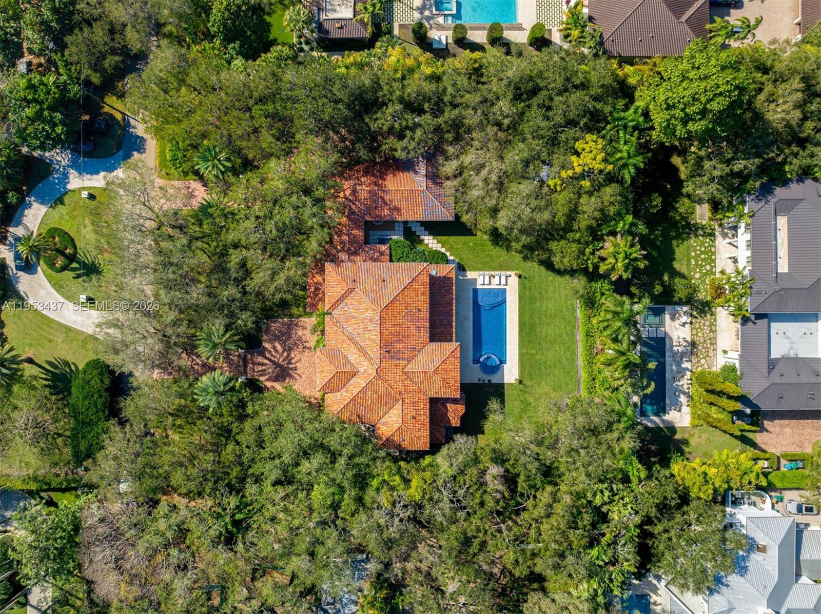 5865 Southwest 96th Street Pinecrest, FL 33156 - Photo 29 of 32 an aerial view of a house with a yard