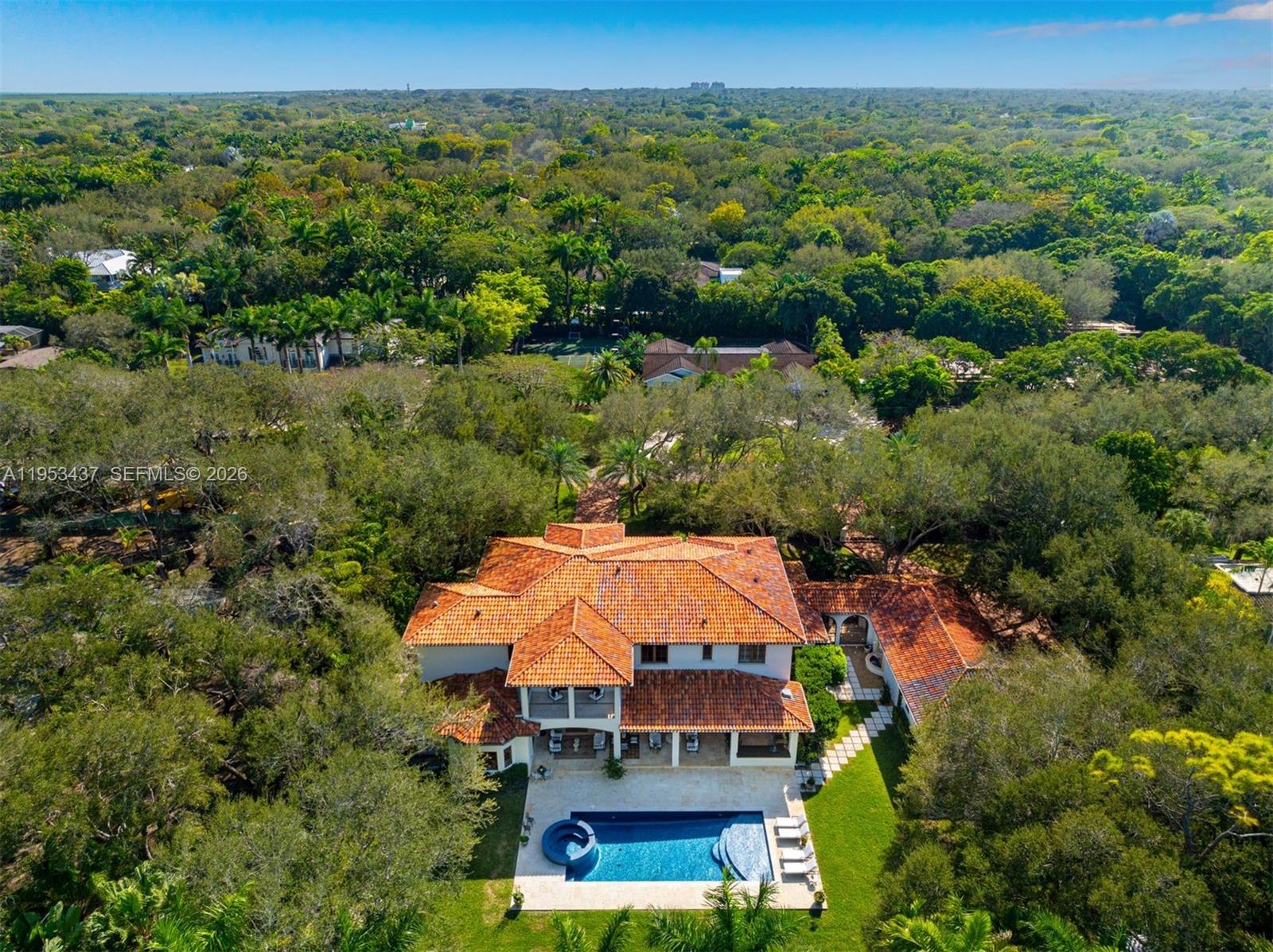 5865 Southwest 96th Street Pinecrest, FL 33156 - Photo 30 of 32 an aerial view of a house with a garden
