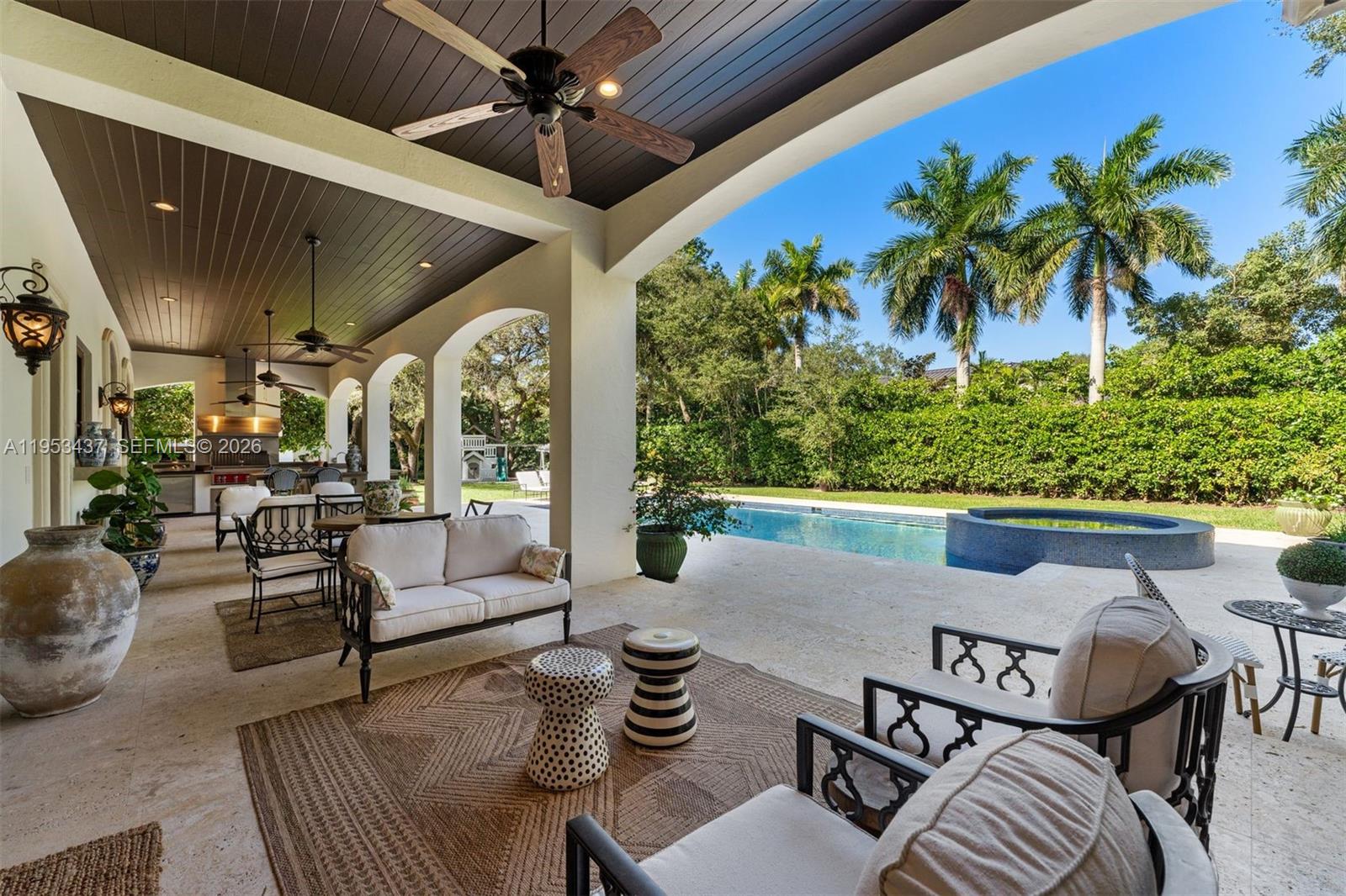 5865 Southwest 96th Street Pinecrest, FL 33156 - Photo 6 of 32 a outdoor living space with furniture and garden view