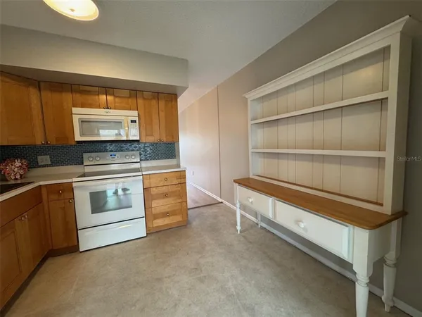 a kitchen with appliances and cabinets