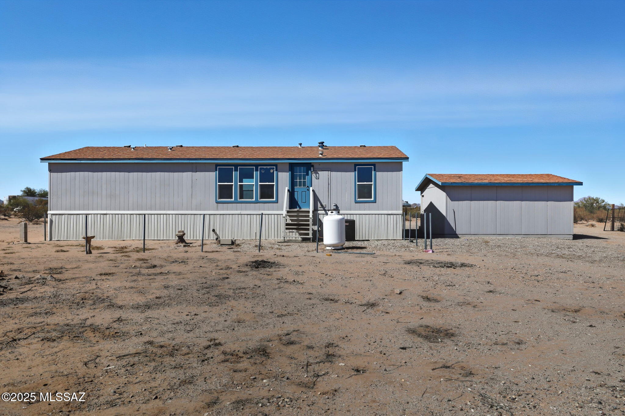 8790 North Trico Road Marana, AZ 85653 - Photo 26 of 35 a front view of a house with a yard