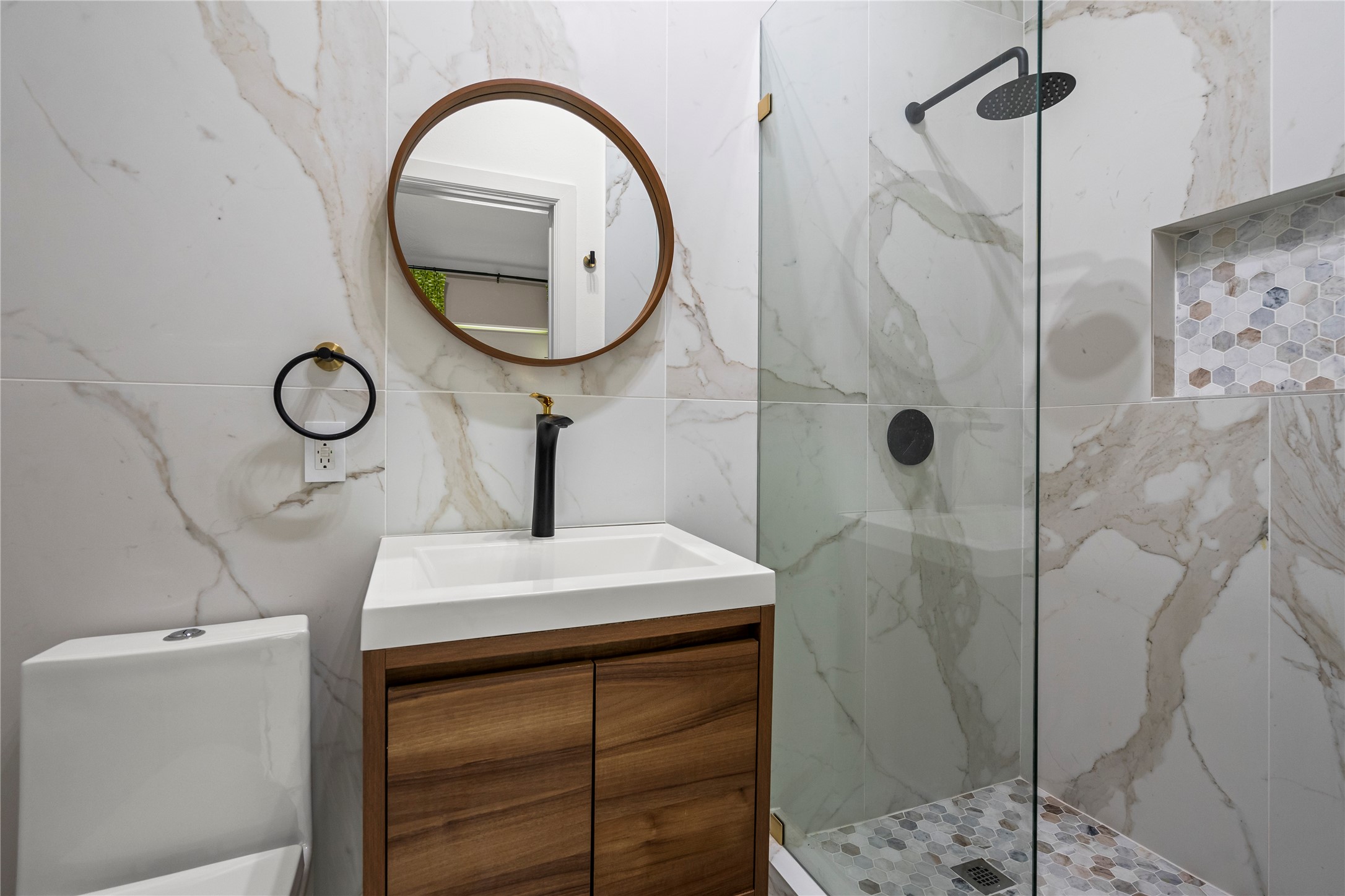31503 Reston Cliff Court Spring, TX 77386 - Photo 23 of 28 a bathroom with a sink a mirror and a shower