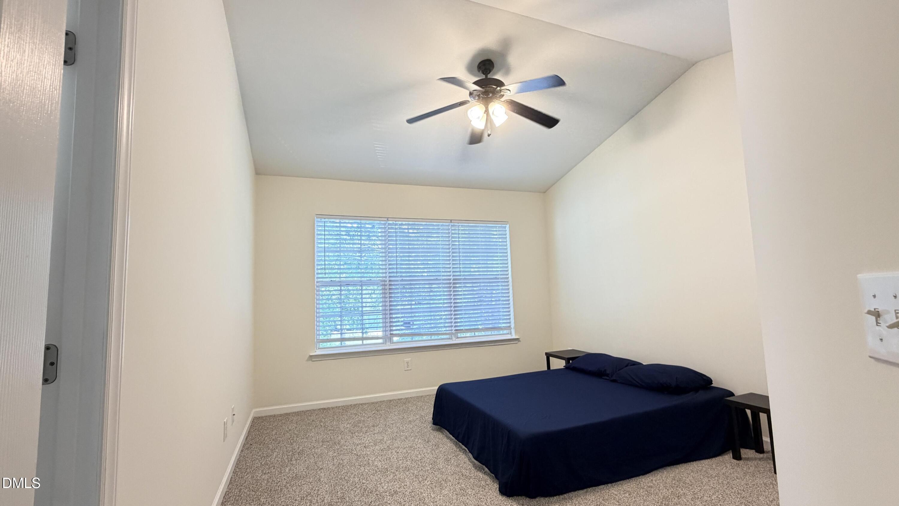 4123 Standing Rock Way Raleigh, NC 27604 - Photo 24 of 29 a living room with a couch and a window