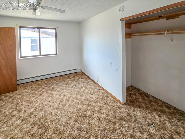a kitchen with a sink a table and chairs