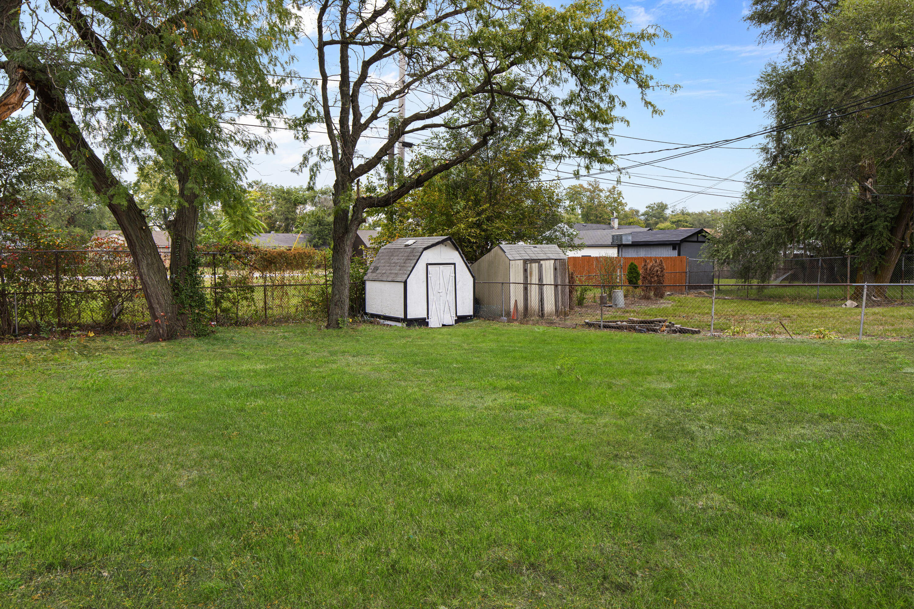 4216 East 13th Avenue Gary, IN 46403 - Photo 16 of 18 a view of a house with backyard and trees