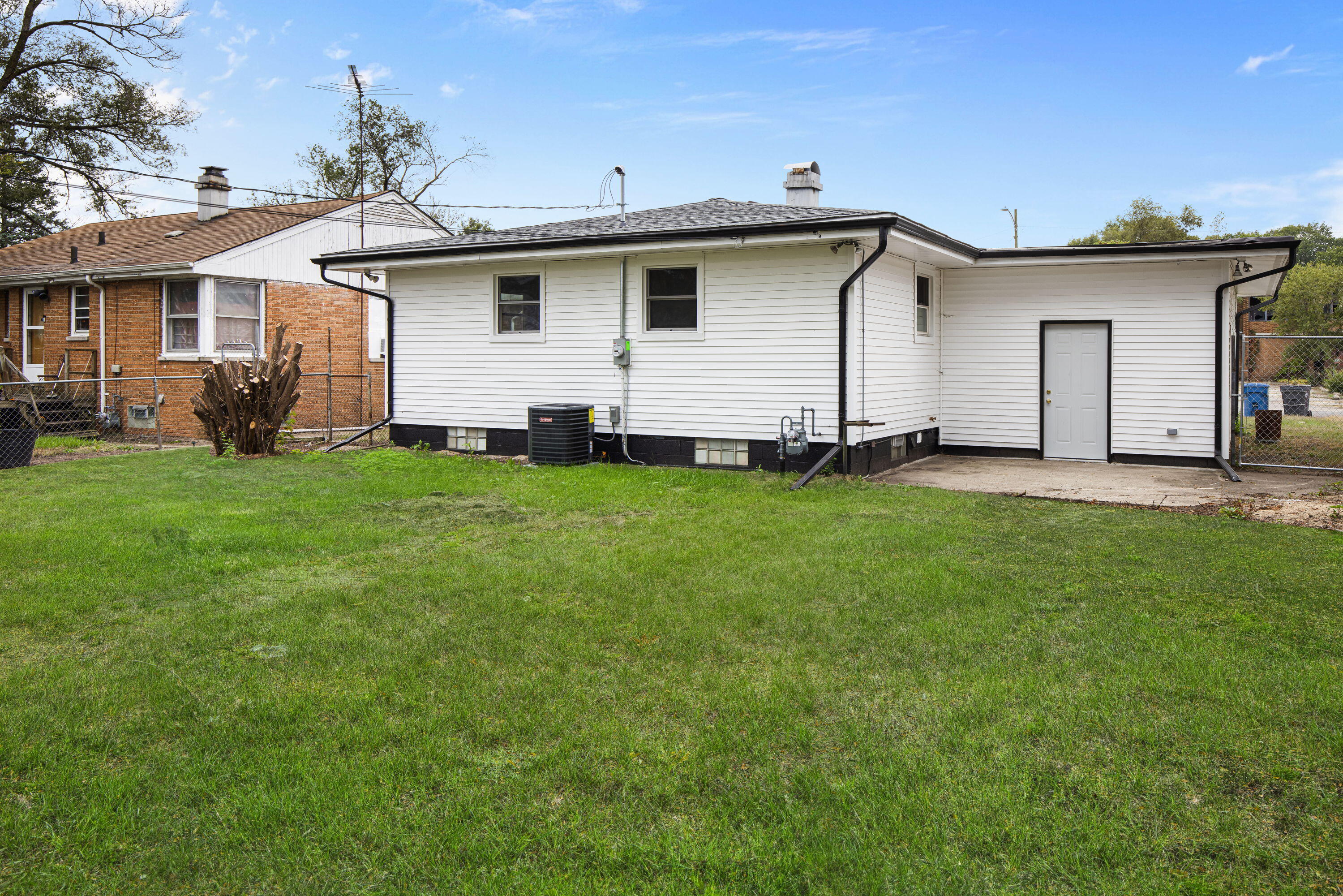 4216 East 13th Avenue Gary, IN 46403 - Photo 17 of 18 a front view of a house with a garden