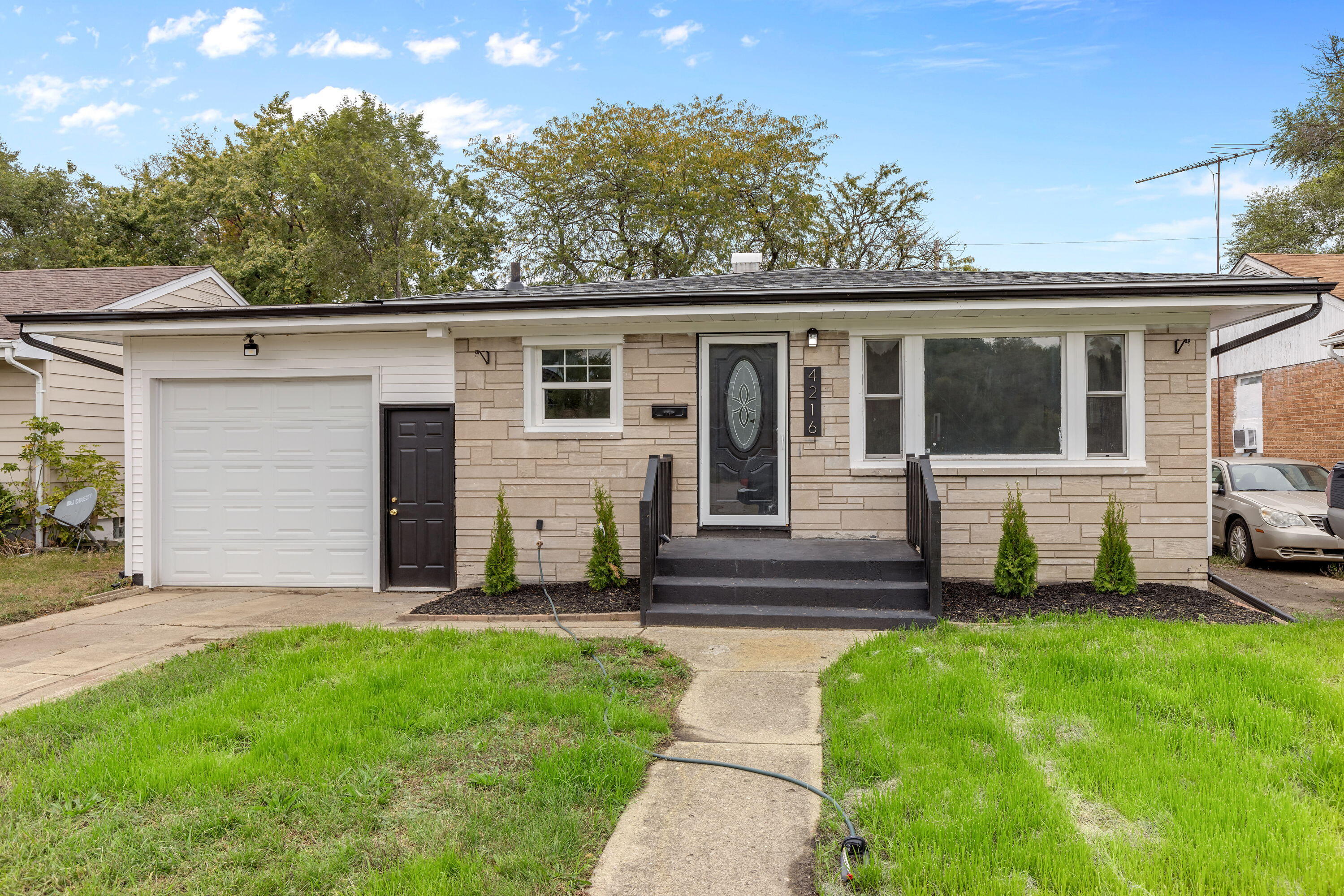 4216 East 13th Avenue Gary, IN 46403 - Photo 2 of 18 a view of a house with a yard