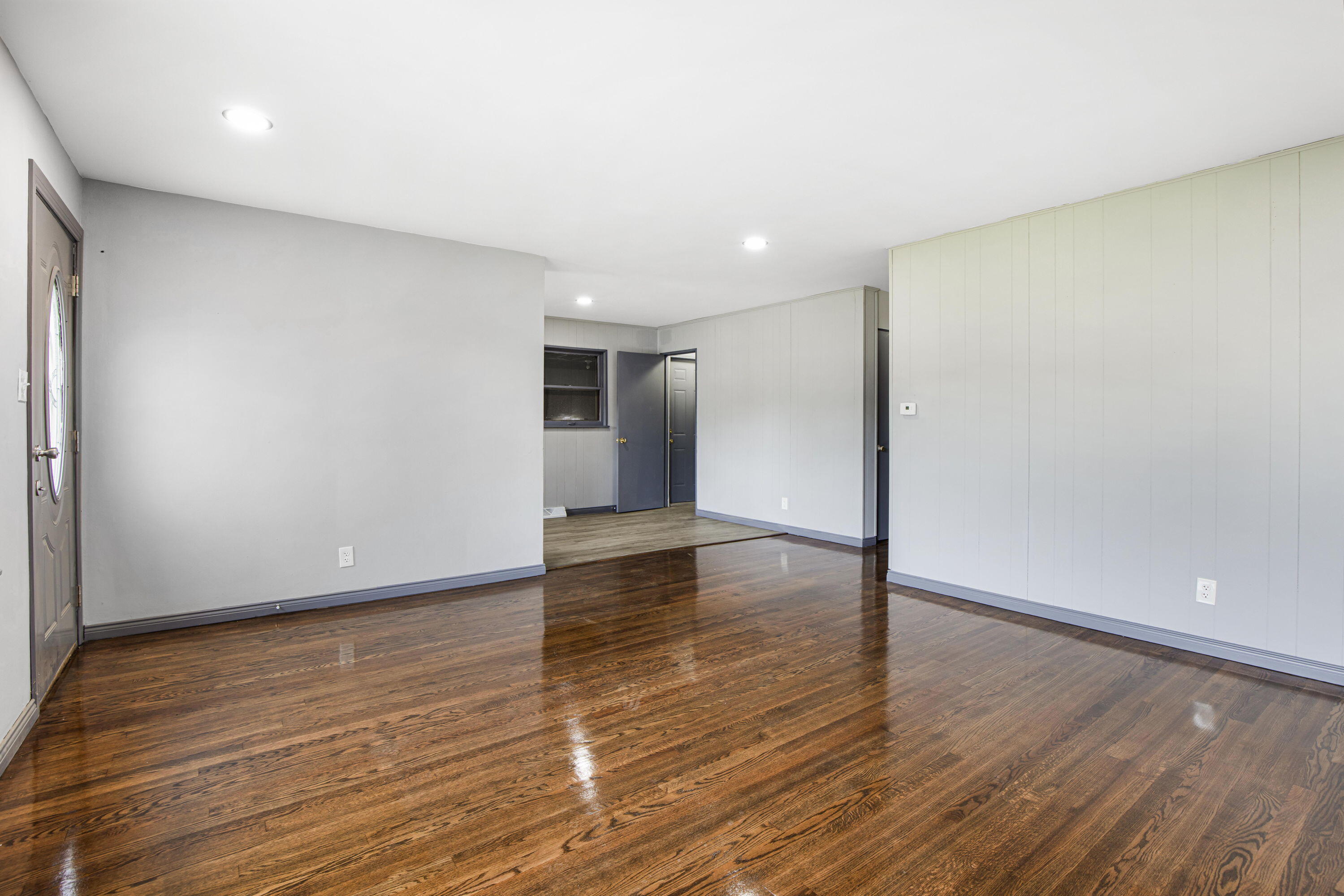 4216 East 13th Avenue Gary, IN 46403 - Photo 4 of 18 a view of an empty room with wooden floor