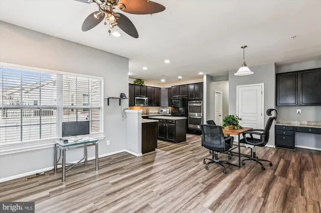 a large bed sitting in a bedroom next to a window