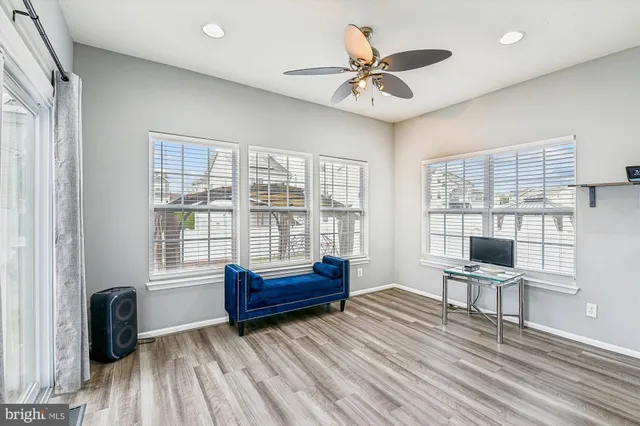 a view of a hallway with seating area